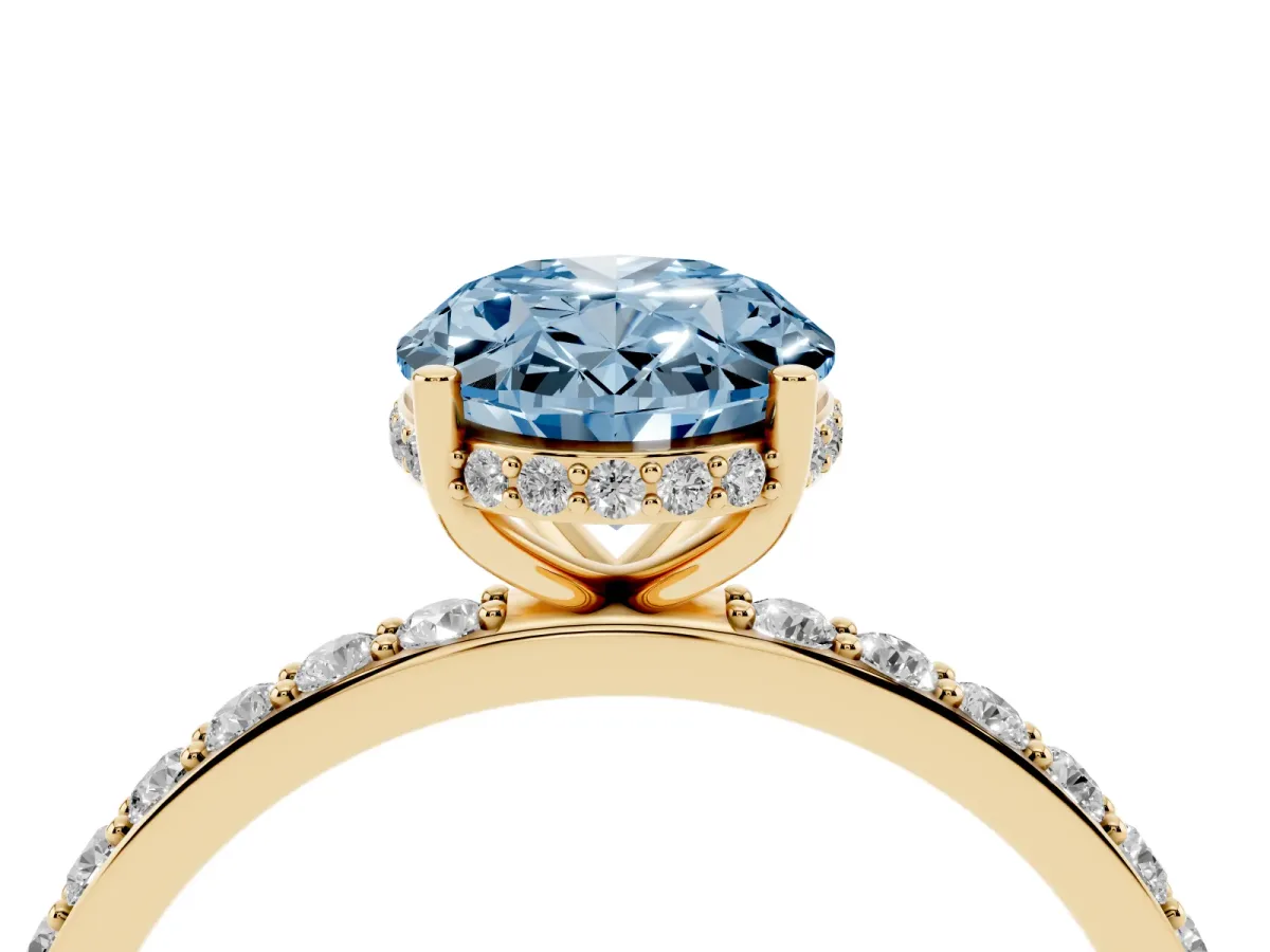 Fancy Blue Oval Cut Diamond Solitaire Ring with Pavé Band and Hidden Halo Yellow gold