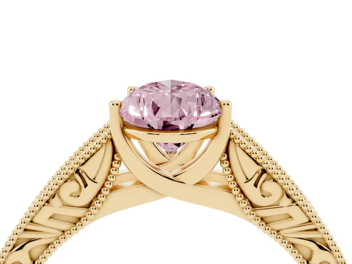 Fancy Pink Pear Cut Diamond Solitaire Ring with Engraved Band and Four-Prong Setting Yellow gold