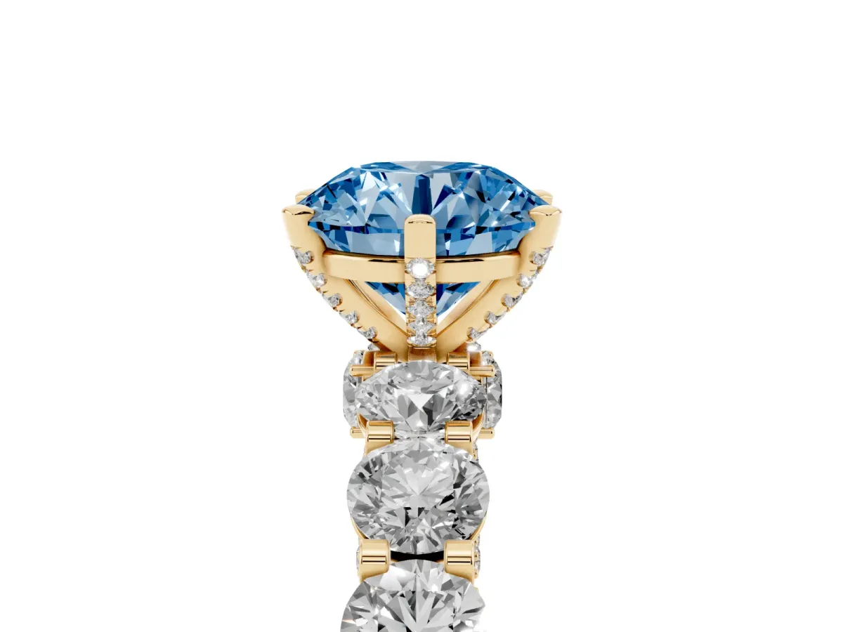 Fancy Blue Round Cut Diamond Side Stone Engagement Ring with Four-Prong Setting Yellow gold