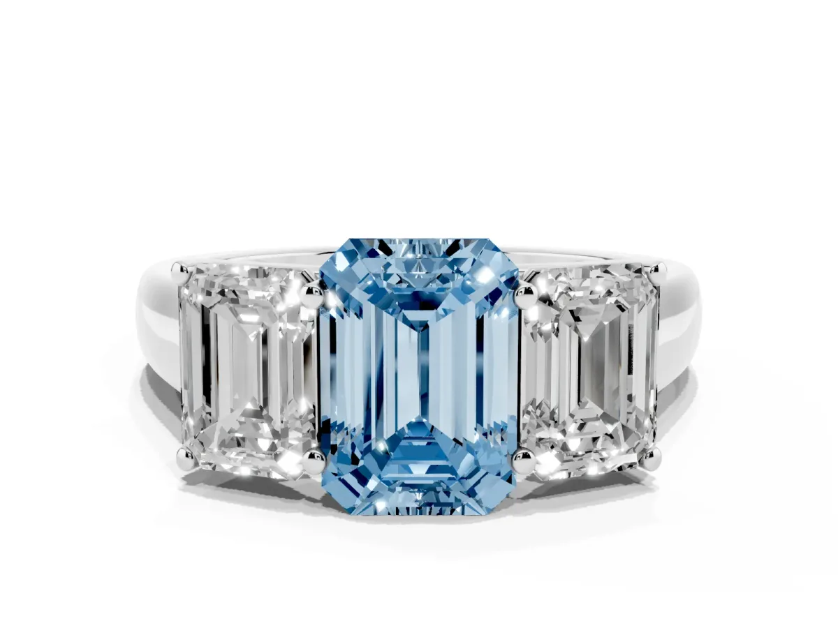 Fancy Blue Emerald Cut Three-Stone Diamond Ring with Prong Setting on a Classic Band Silver