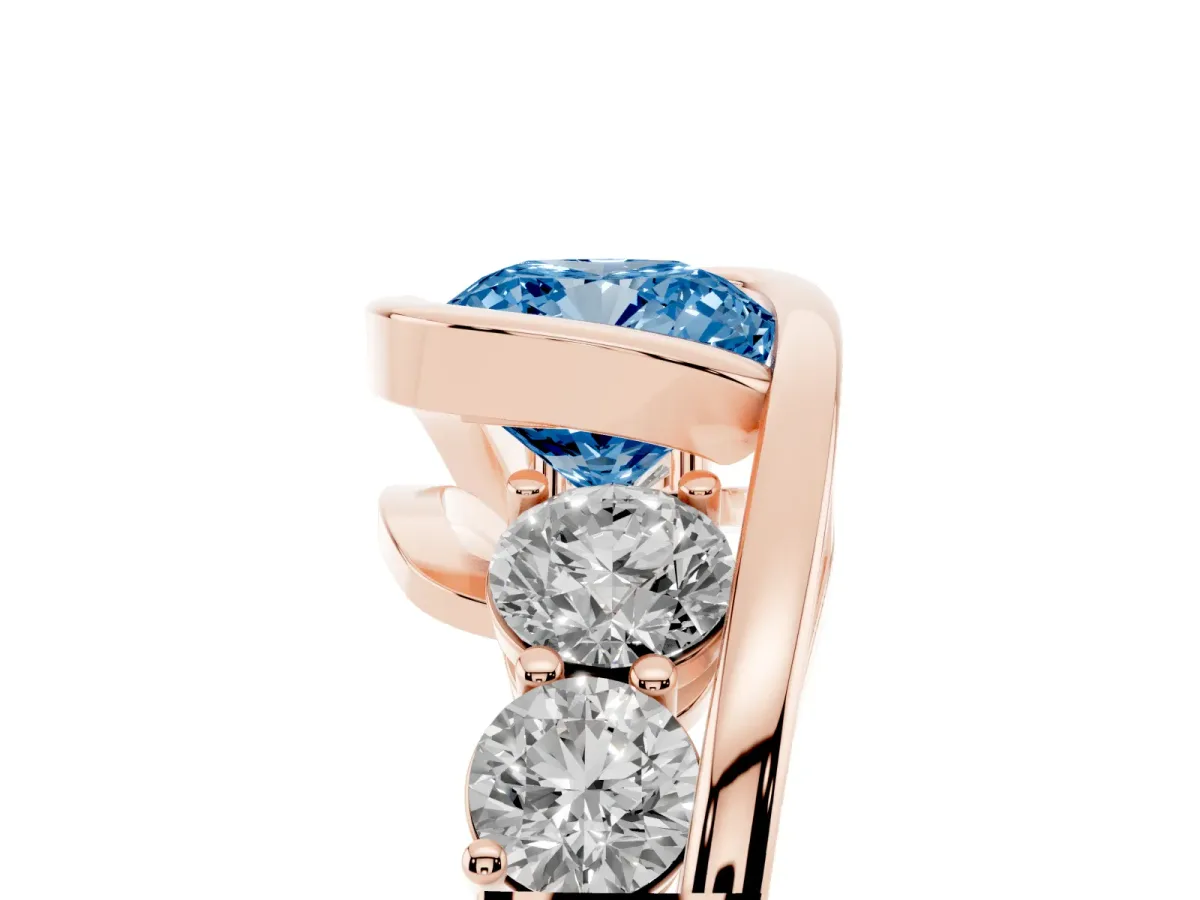 Fancy Blue Bezel Set Cushion Cut Diamond Bypass Ring with Round Accents Rose gold