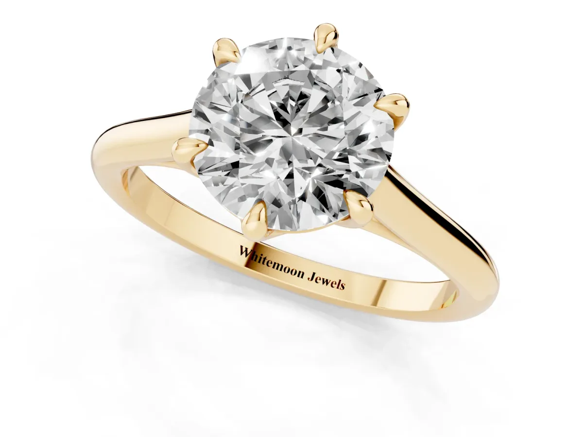 Round Cut Solitaire Engagement Ring with Six-Prong Setting and Classic Band Yellow gold