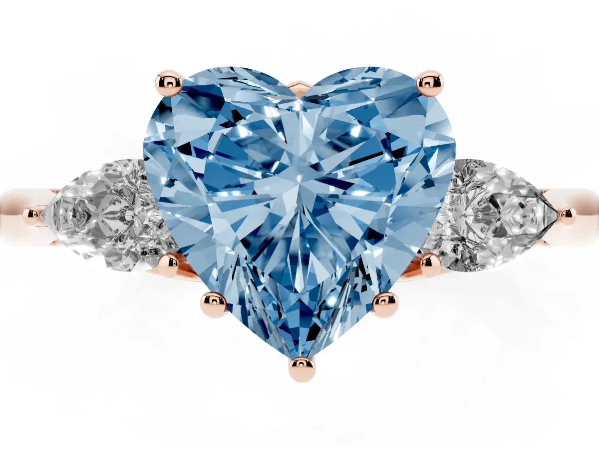 Fancy Blue Three-Stone Heart Cut Diamond Ring with Pear Side Stones in Four-Prong Setting Rose gold