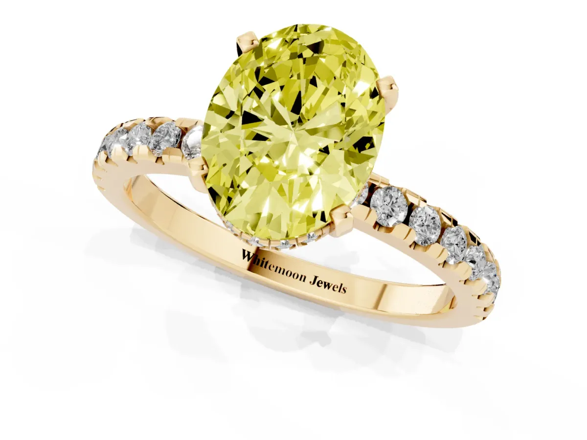 Fancy Yellow Oval Cut Diamond Solitaire Ring with Round Pavé Band and Four-Prong Setting Yellow gold