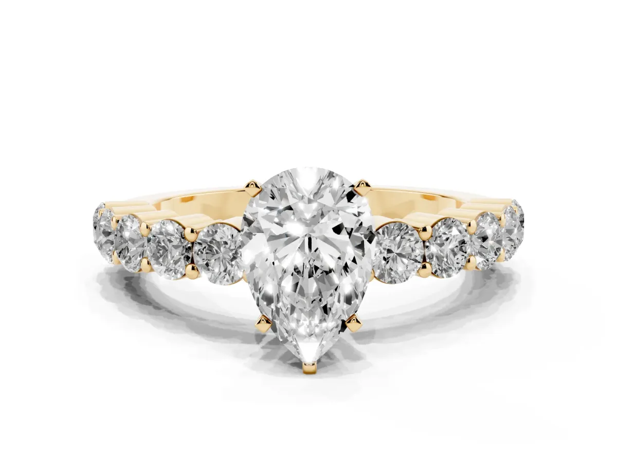 Pear Cut Diamond Solitaire Ring with Shared Prong Round Side Stones Yellow gold