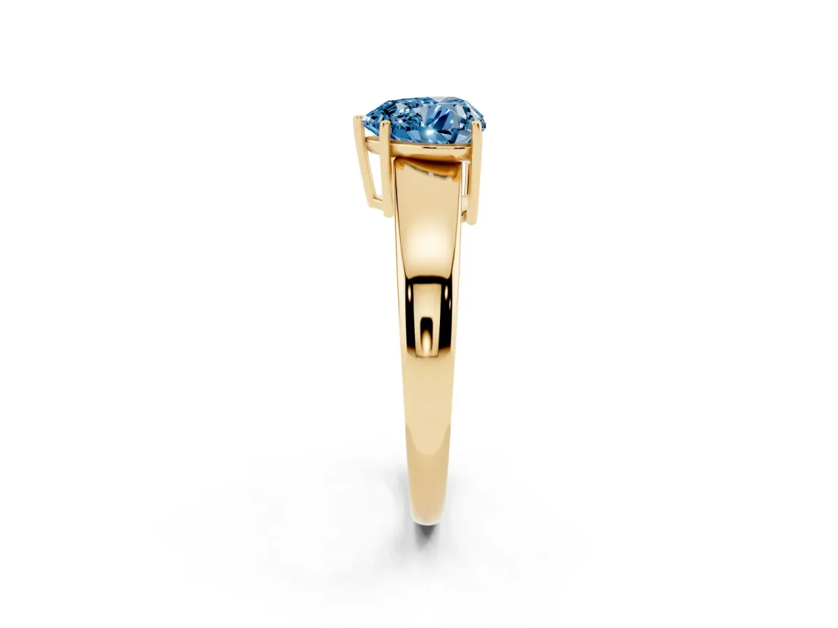 Fancy Blue Heart Cut Solitaire Diamond Ring with Tapered Band and Four-Prong Setting Yellow gold