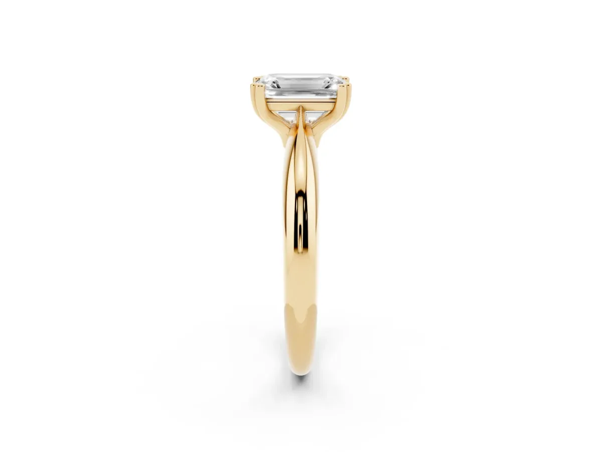 Emerald Cut Cut Solitaire Engagement Ring with Tapered Band and Four-Prong Setting Yellow gold