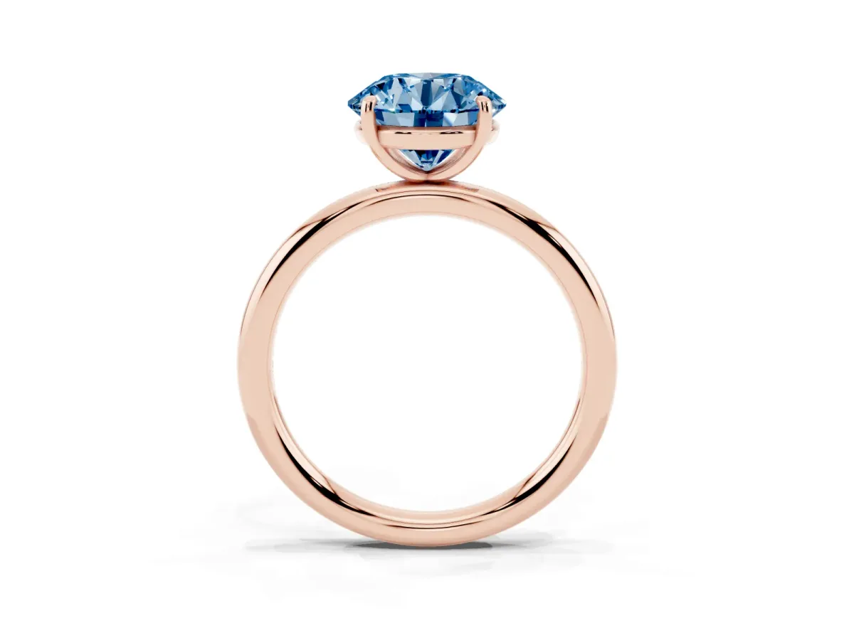 Fancy Blue Round Cut Solitaire Diamond Ring with Four-Prong Setting on a Plain Band Rose gold
