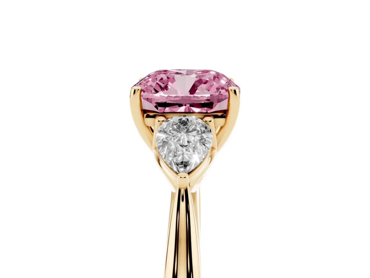 Fancy Pink Cushion Cut Diamond Three-Stone Ring with Pear Side Stones and Prong Setting Yellow gold