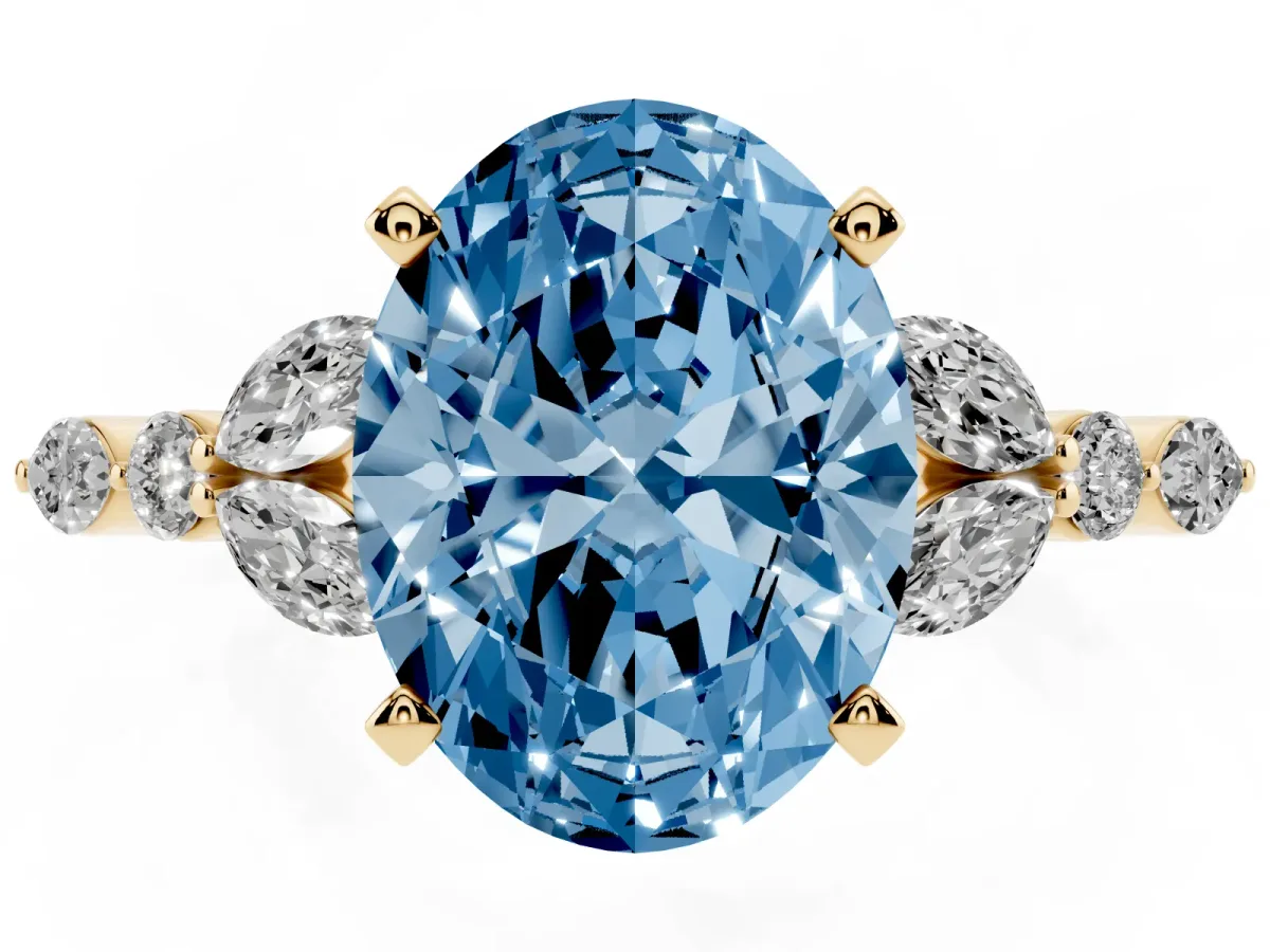 Fancy Blue Oval Cut Diamond Solitaire Ring with Side Stones and Four-Prong Setting Yellow gold