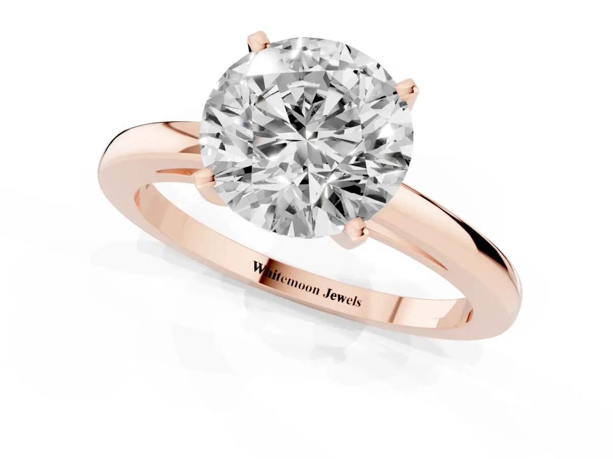 Round Cut Solitaire Diamond Engagement Ring with Four-Prong Setting on a Classic Band Rose gold