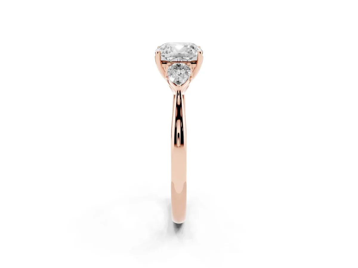 Cushion Cut Diamond Three-Stone Ring with Pear Side Stones and Prong Setting Rose gold