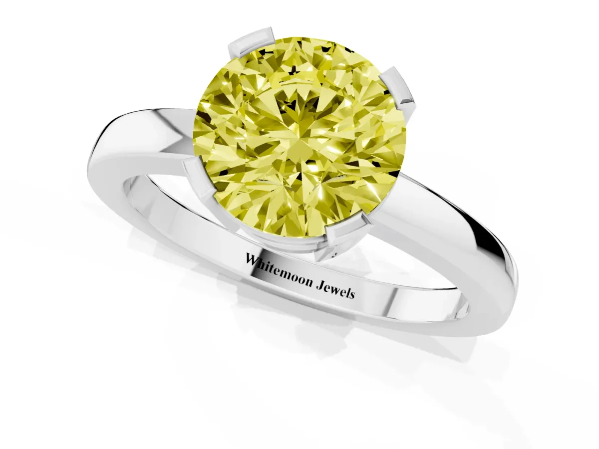 Fancy Yellow Round Cut Cut Solitaire Ring with Four-Prong Setting and Classic Band Silver