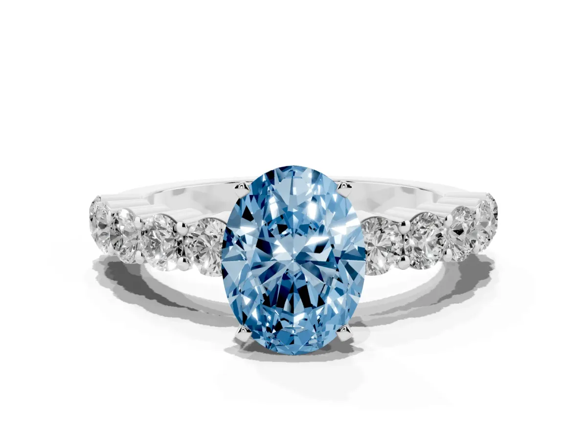 Fancy Blue Oval Cut Diamond Solitaire Ring with Shared Prong Round Side Stones Silver
