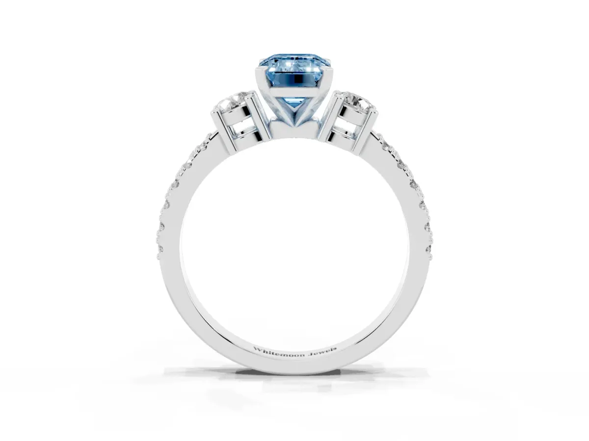 Fancy Blue Emerald Cut Three-Stone Diamond Pavé Band with Prong Setting Platinum