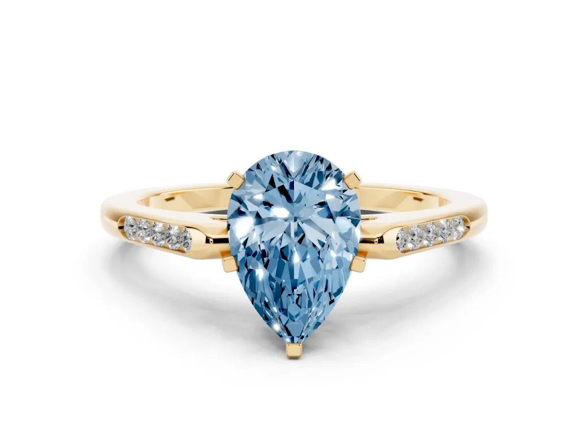 Fancy Blue Pear Cut Diamond Solitaire Ring with Channel Set Round Band and Prong Setting Yellow gold
