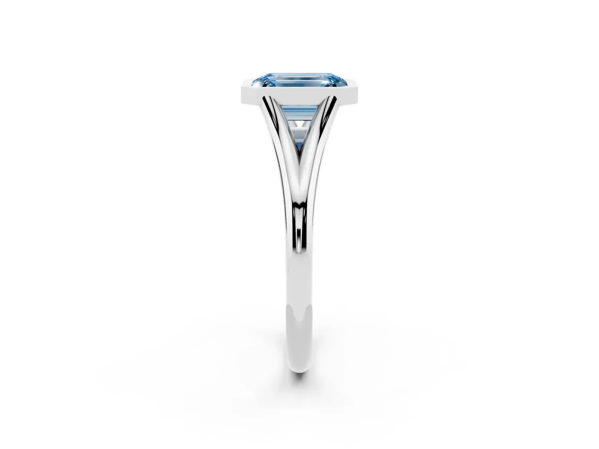 Fancy Blue Bezel Set Emerald Cut Cut Solitaire Ring with Tapered Band Silver