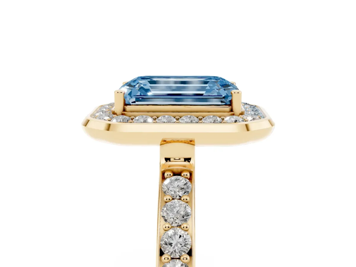 Fancy Blue Emerald Cut Diamond Halo Ring with Bezel Frame and Pavé Band Yellow gold
