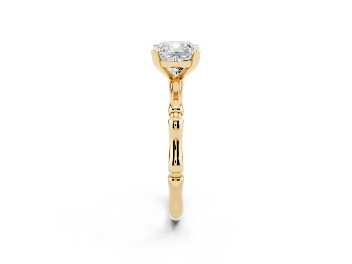 Cushion Cut Solitaire Diamond Ring with Bamboo Band and Four-Prong Setting Yellow gold