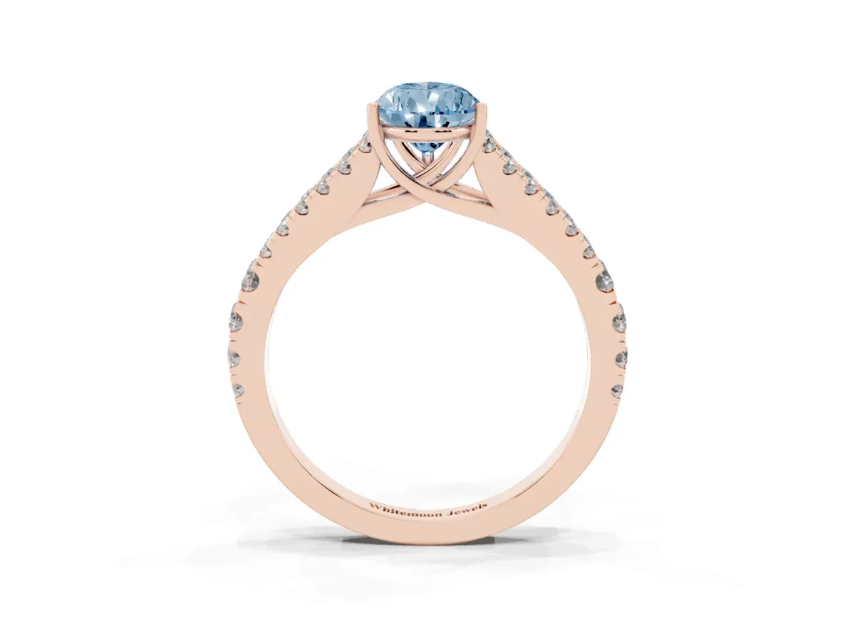 Fancy Blue Pear Cut Diamond Split Shank Engagement Ring with Round Pavé and Prong Setting Rose gold
