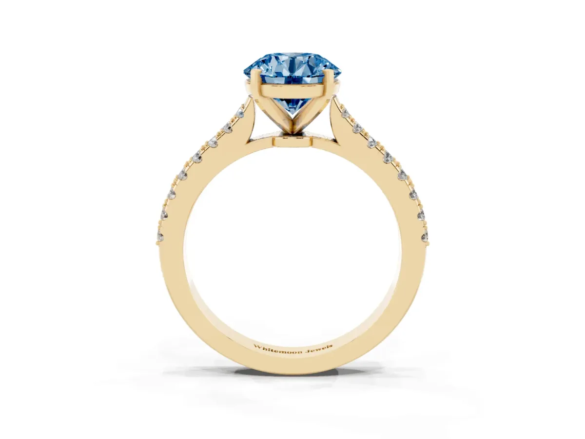 Fancy Blue Round Cut Cut Solitaire Diamond Engagement Ring with Pave Band and Four-Prong Setting Yellow gold