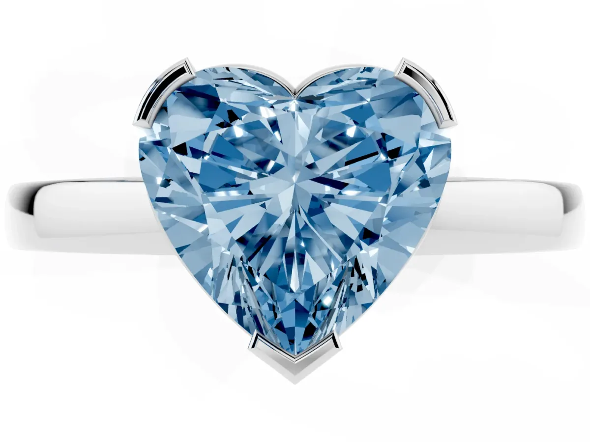 Fancy Blue Heart Cut Cut Solitaire Ring with Four-Prong Setting and Classic Band Silver