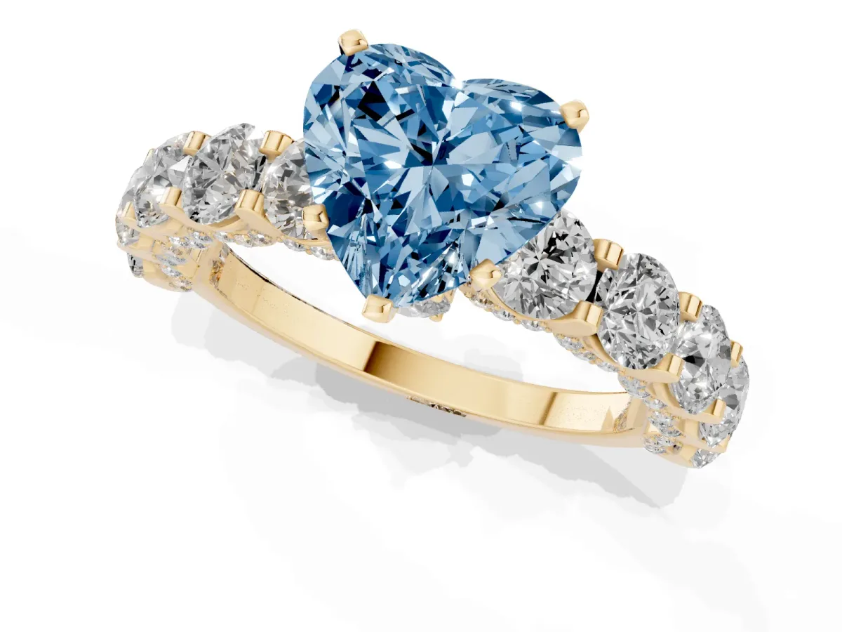 Fancy Blue Heart Cut Diamond Side Stone Engagement Ring with Four-Prong Setting Yellow gold