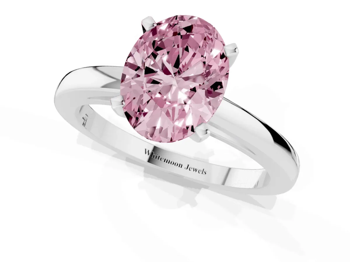 Fancy Pink Oval Cut Solitaire Diamond Engagement Ring with Four-Prong Setting on a Classic Band Platinum