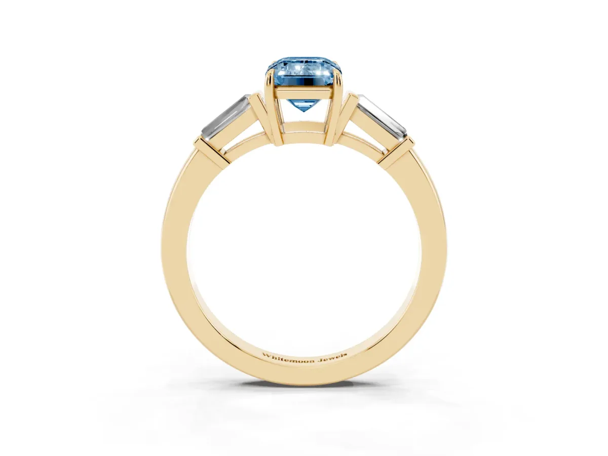 Fancy Blue Emerald Cut Diamond Three-Stone Ring with Tapered Baguette Side Stones and Prong Setting Yellow gold