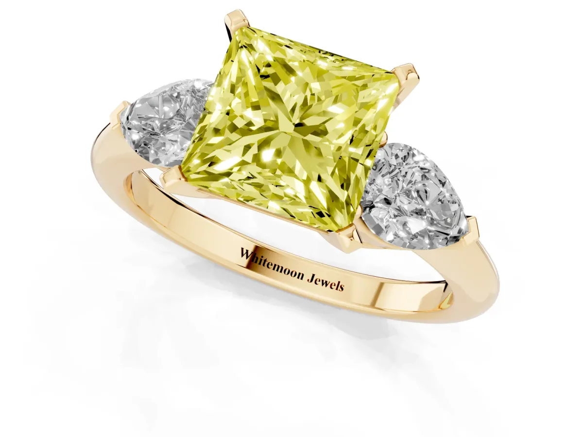 Fancy Yellow Three-Stone Princess Cut Diamond Ring with Pear Side Stones and Four-Prong Setting Yellow gold