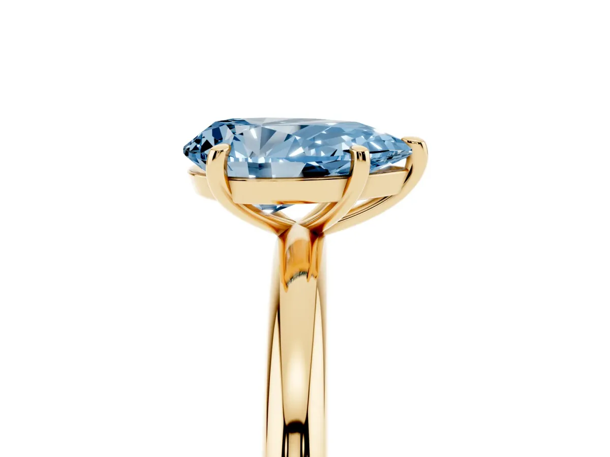 Fancy Blue Pear Cut Solitaire Diamond Ring with Four-Prong Setting on a Plain Band Yellow gold