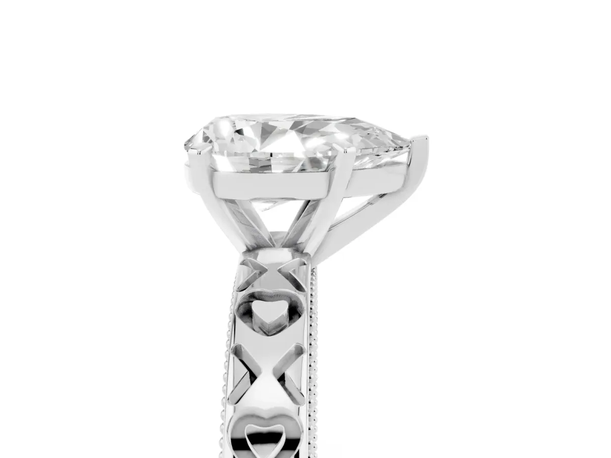 Pear Cut Solitaire Diamond Engagement Ring with XO Engraved Band and Four-Prong Setting White gold