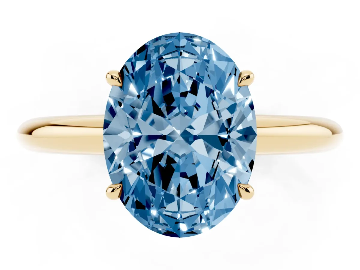 Fancy Blue Oval Cut Brilliant Solitaire Engagement Ring with Six-Prong Setting and Classic Band Yellow gold