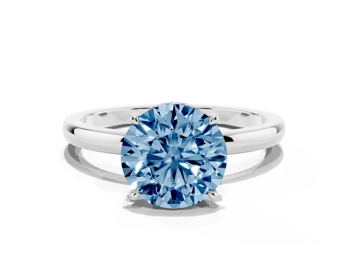 Fancy Blue Round Cut Solitaire Engagement Ring with Cathedral Band and Four-Prong Setting Silver
