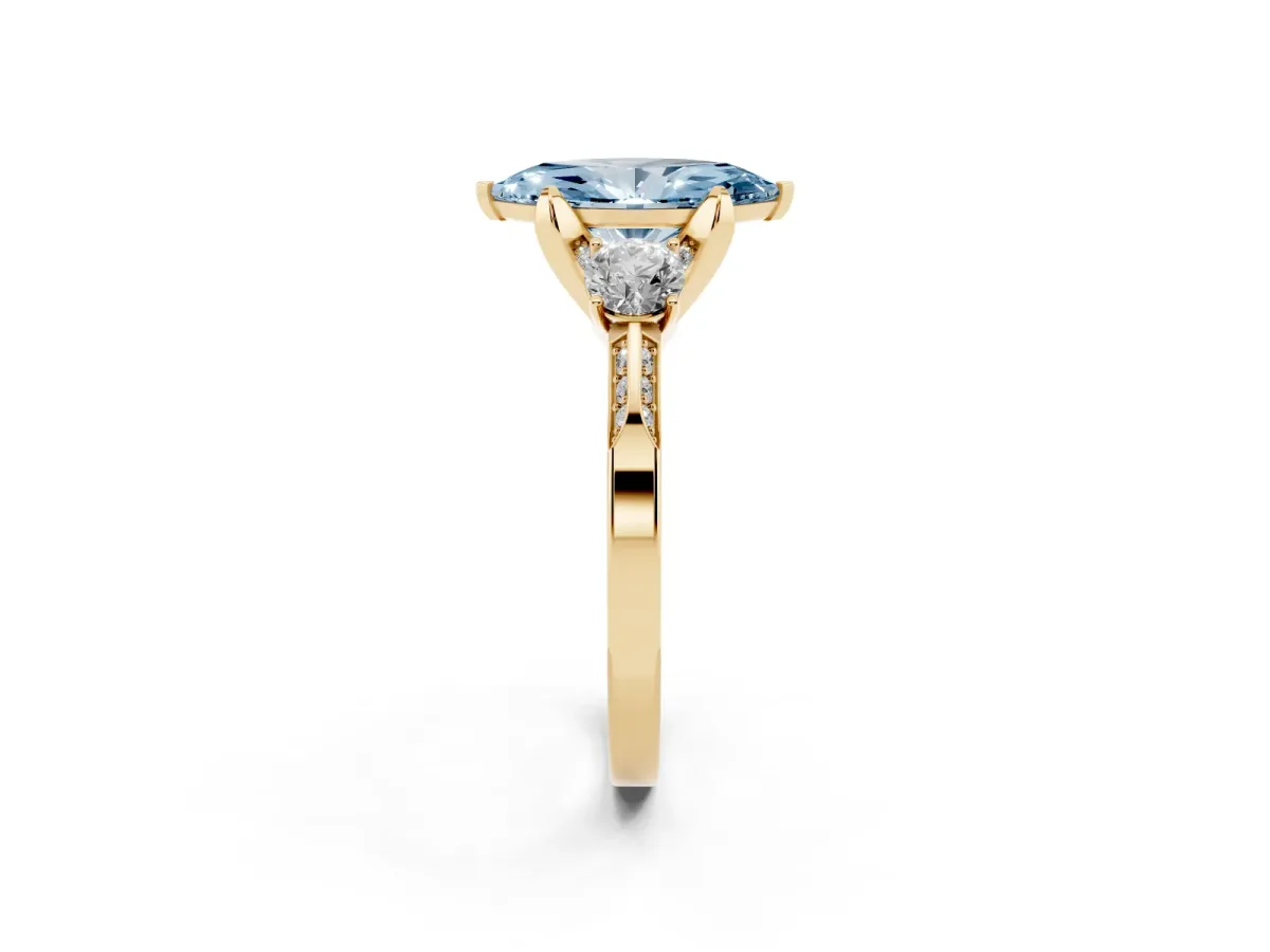 Fancy Blue Marquise Cut Brilliant Three-Stone Diamond Ring with Pavé Band and Four-Prong Setting Yellow gold