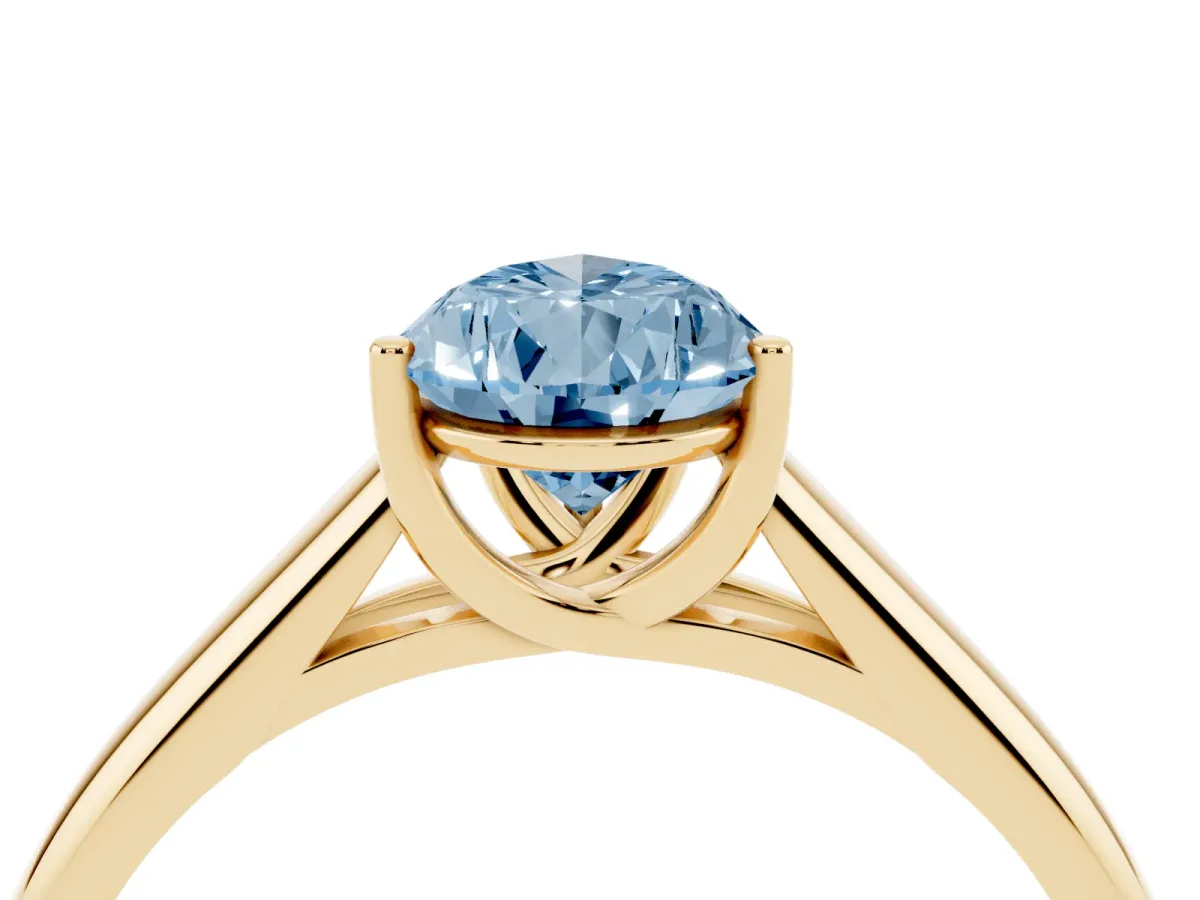 Fancy Blue Pear Cut Solitaire Engagement Ring with Tapered Band and Four-Prong Setting Yellow gold