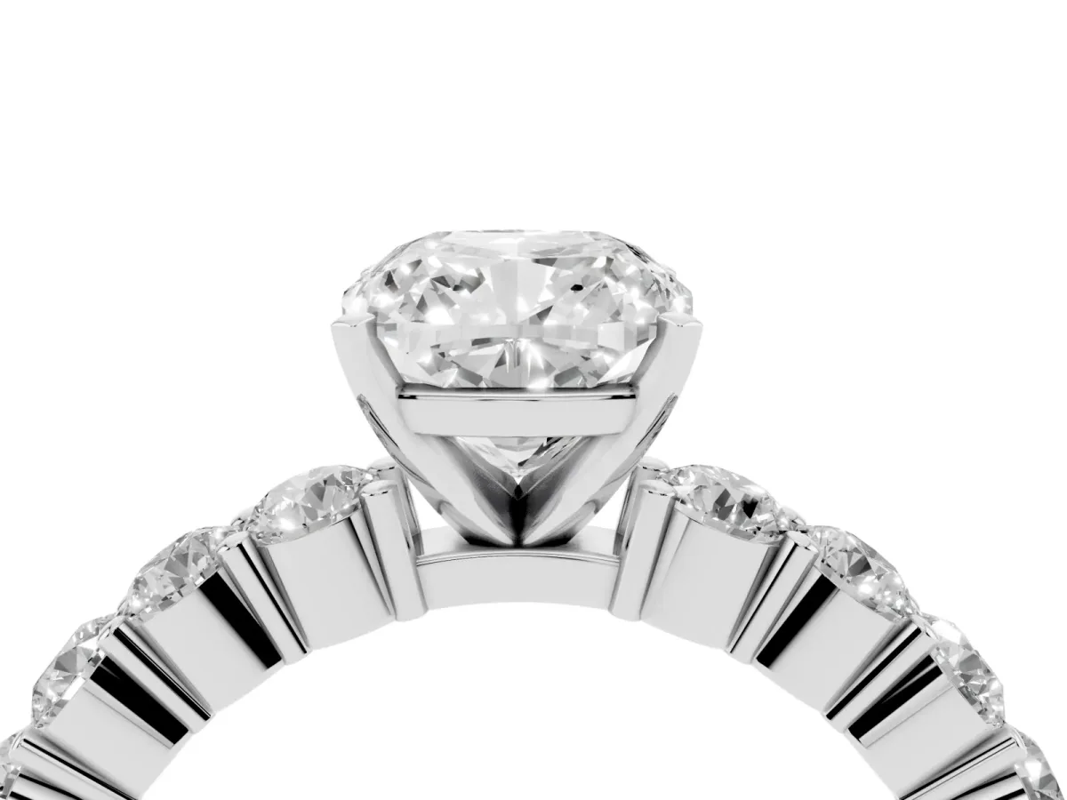 Cushion Cut Diamond Solitaire Ring with Shared Prong Round Side Stones Platinum