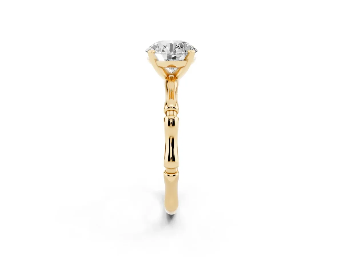 Round Cut Solitaire Diamond Ring with Bamboo Band and Four-Prong Setting Yellow gold