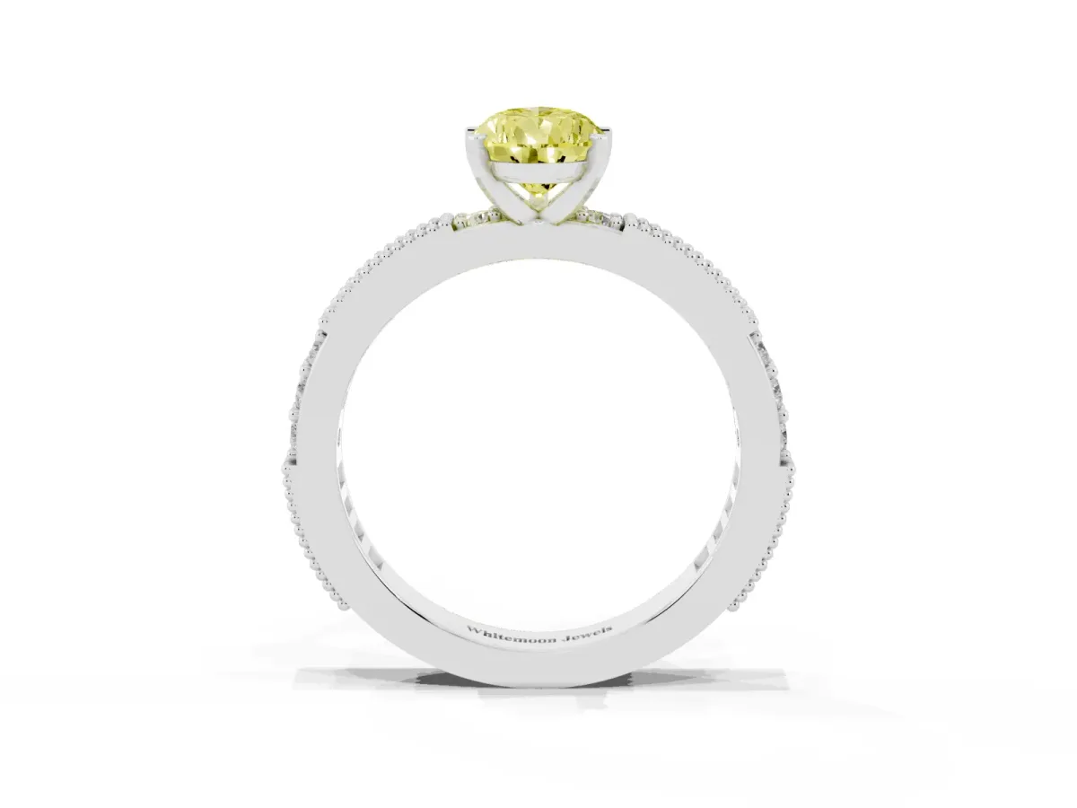 Fancy Yellow Pear Cut Solitaire with Pavé Band and Four-Prong Setting Platinum