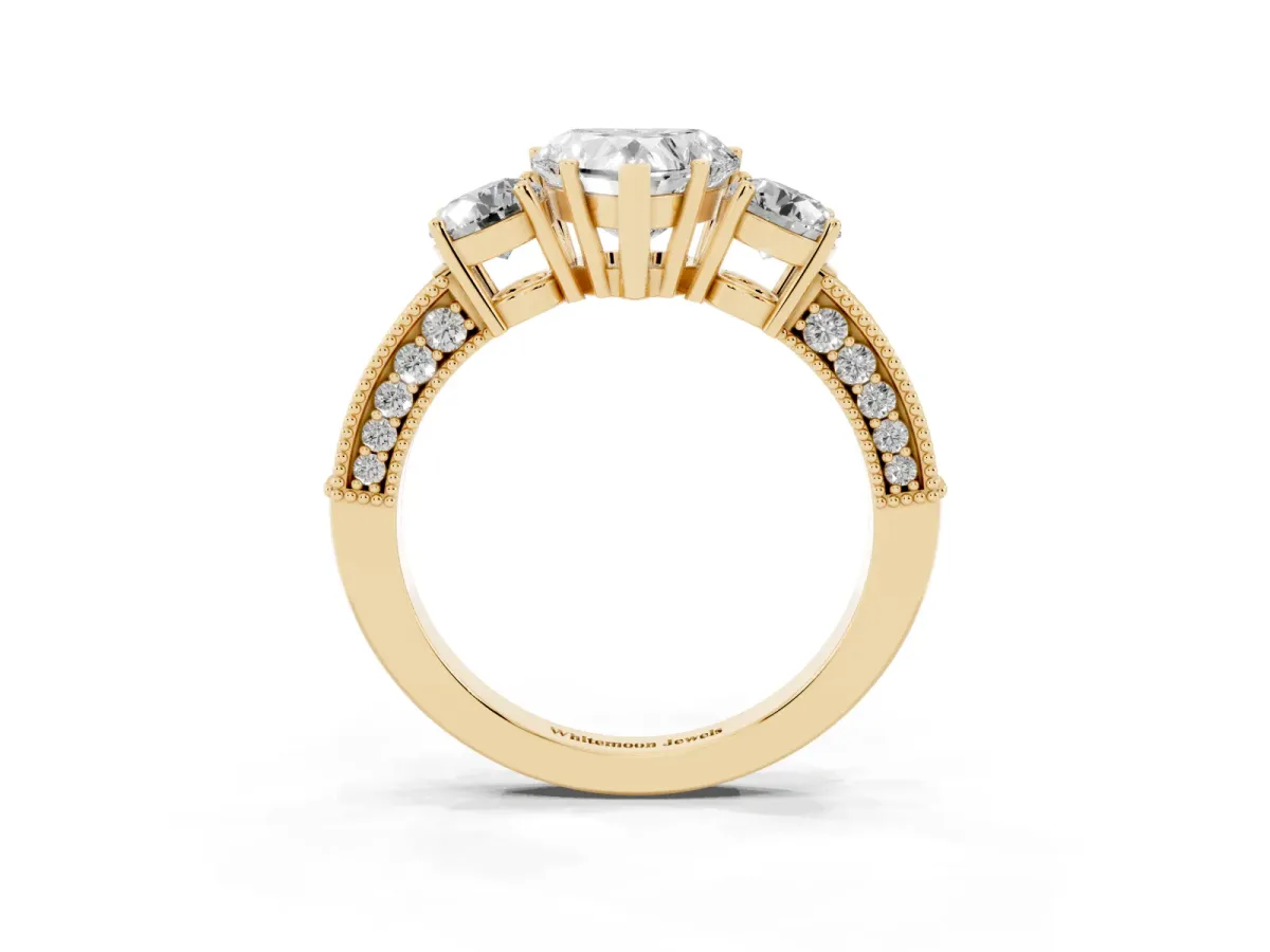 Heart Cut Three-Stone Diamond Ring with Pavé Band and Four-Prong Setting Yellow gold
