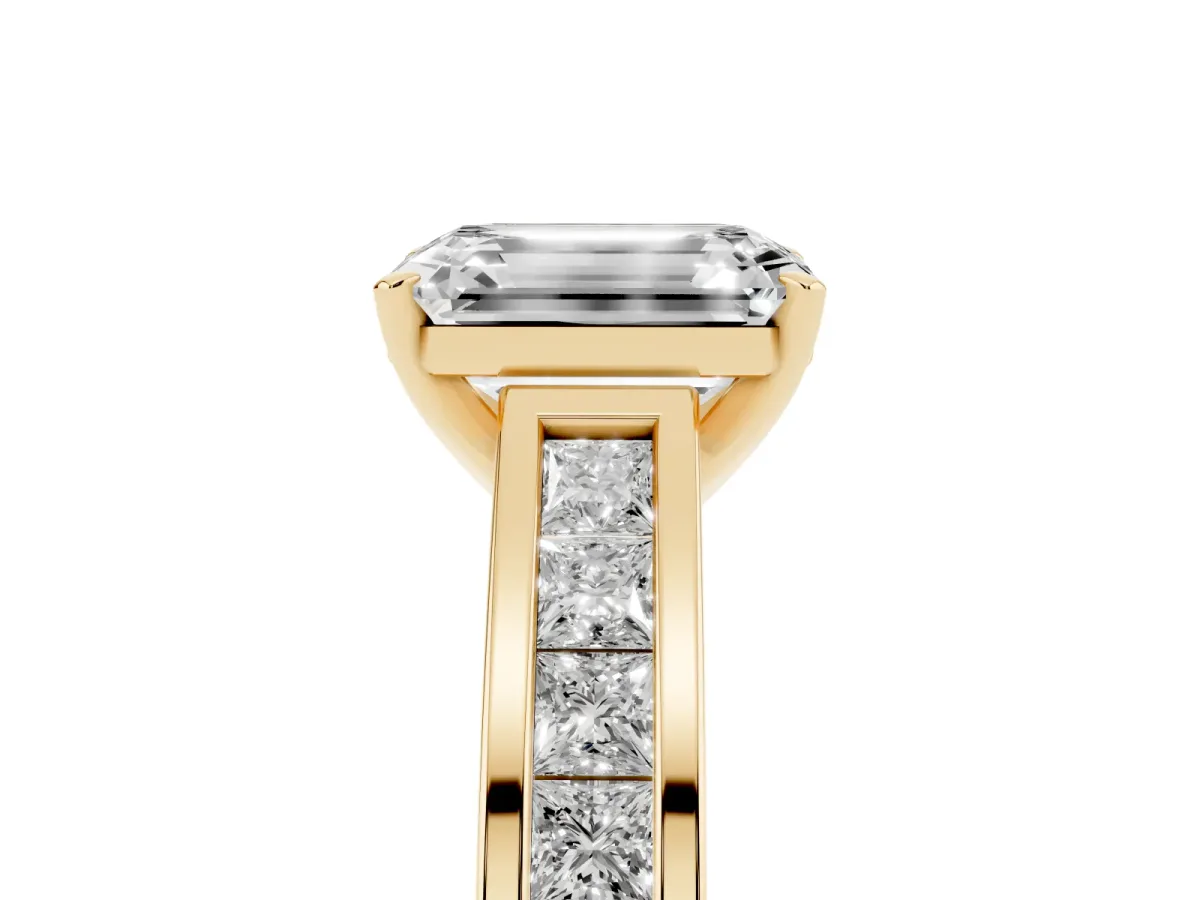 Emerald Cut Solitaire Diamond Ring with Channel-Set Band and Four-Prong Setting Yellow gold