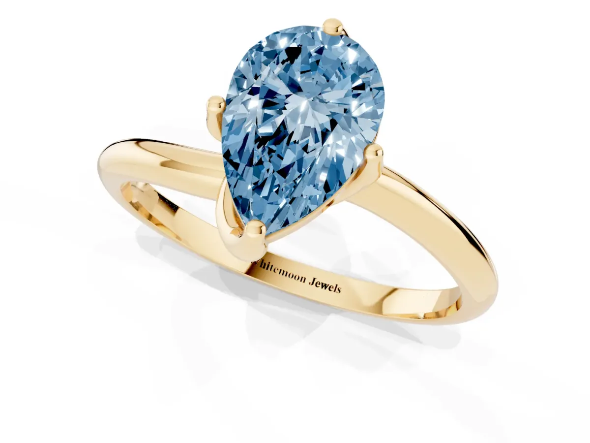 Fancy Blue Pear Cut Diamond Solitaire Engagement Ring with Four-Prong Setting and Classic Band Yellow gold