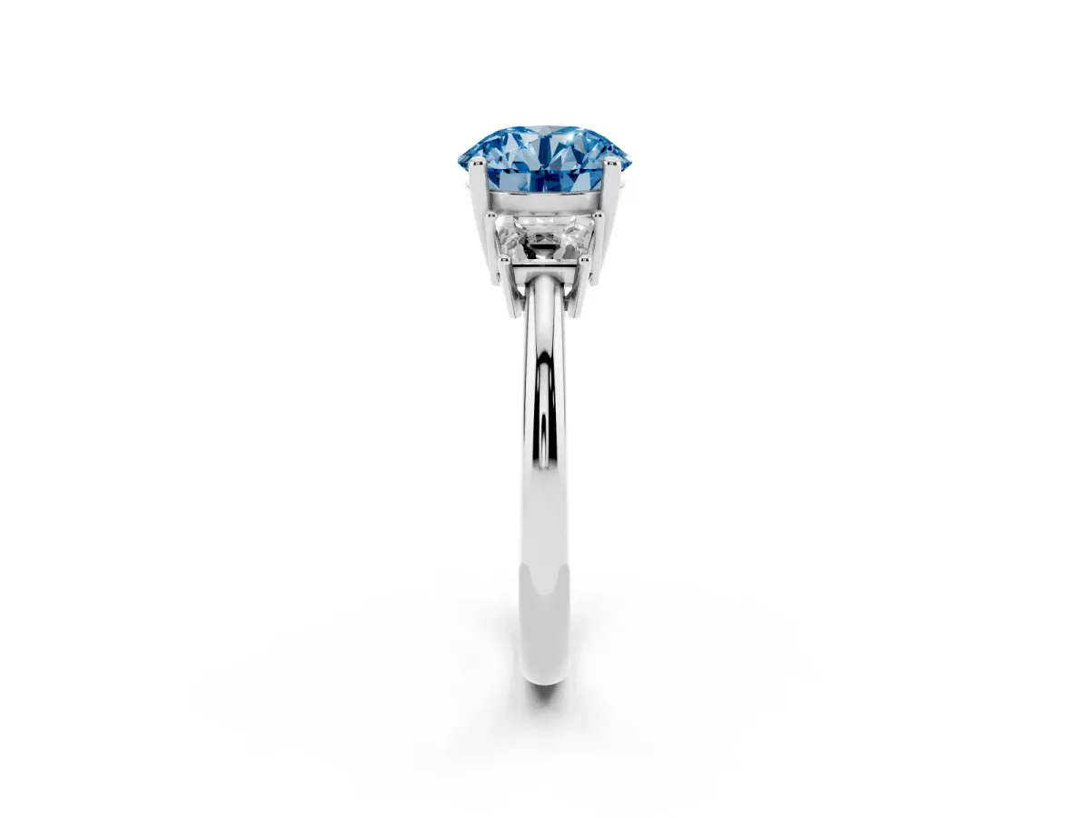 Fancy Blue Round Cut Diamond Three-Stone Ring with Trapezoid Side Stones and Prong Setting Platinum