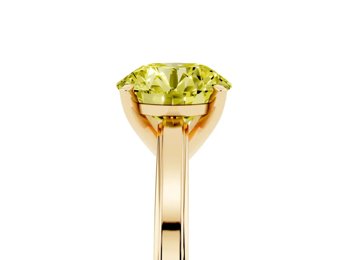 Fancy Yellow Round Cut Solitaire Diamond Ring with Four-Prong Setting and Classic Band Yellow gold