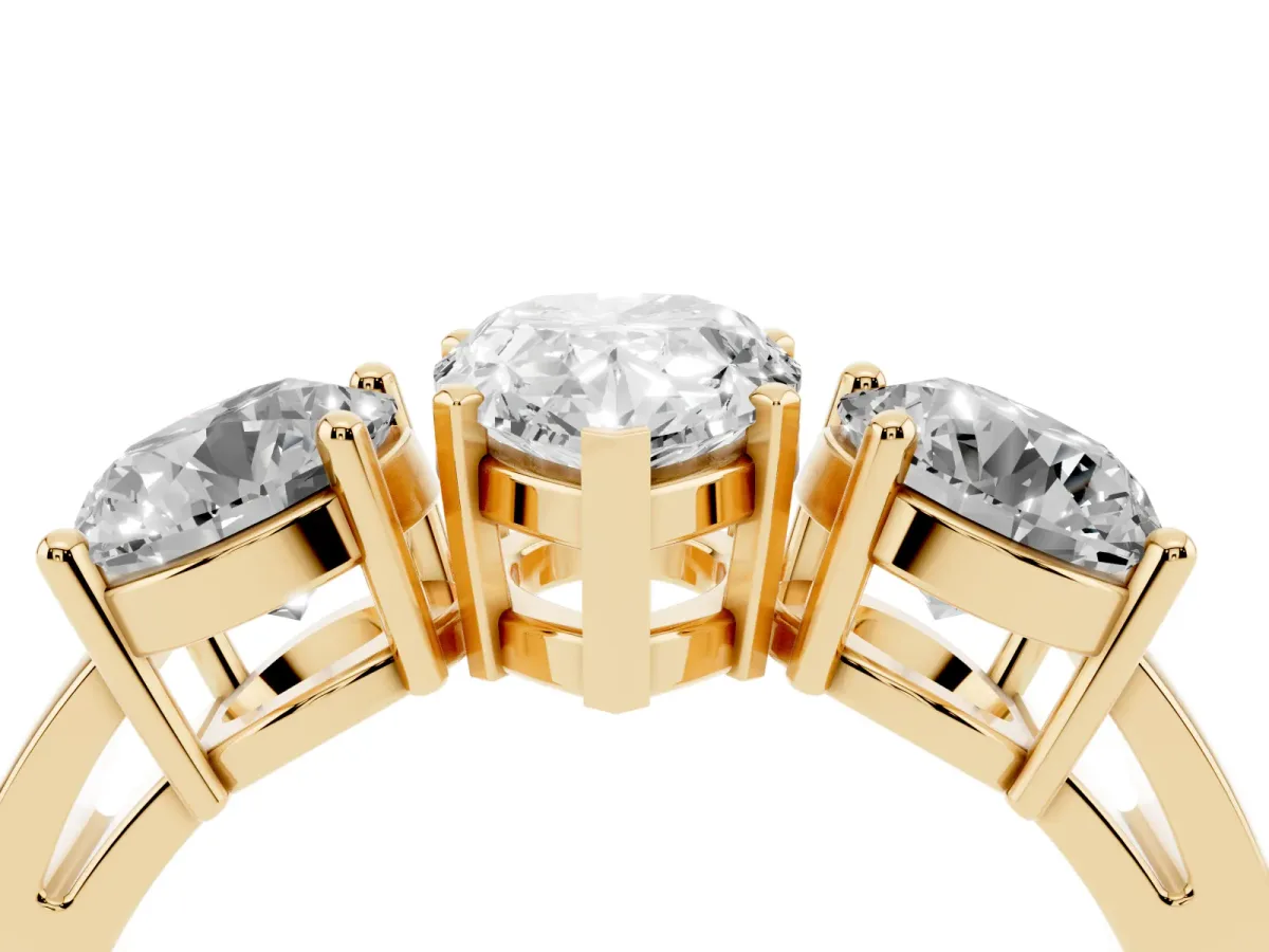 Three-Stone Pear Cut Diamond Ring with Round Side Stones, Classic Band, and Four-Prong Setting Yellow gold