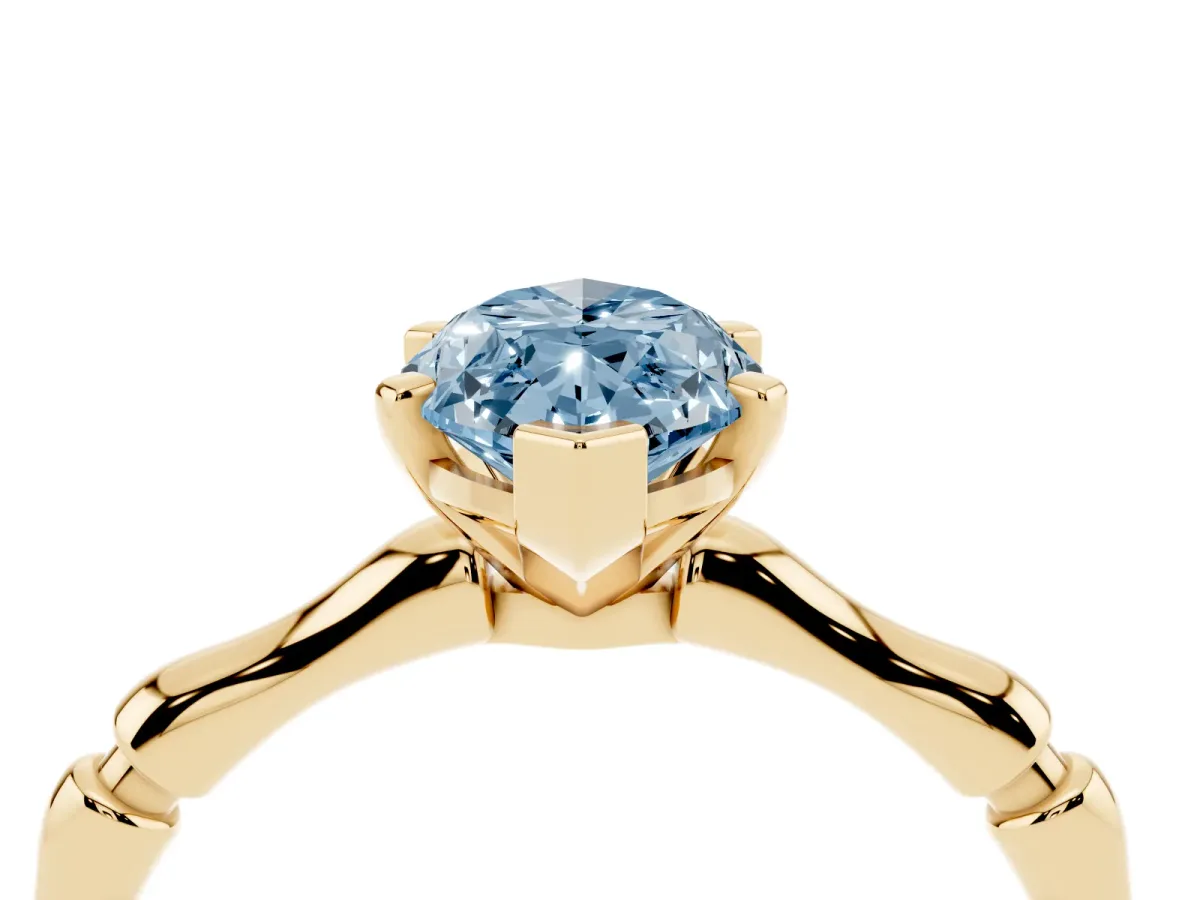 Fancy Blue Marquise Cut Solitaire Diamond Ring with Bamboo Band and Four-Prong Setting Yellow gold