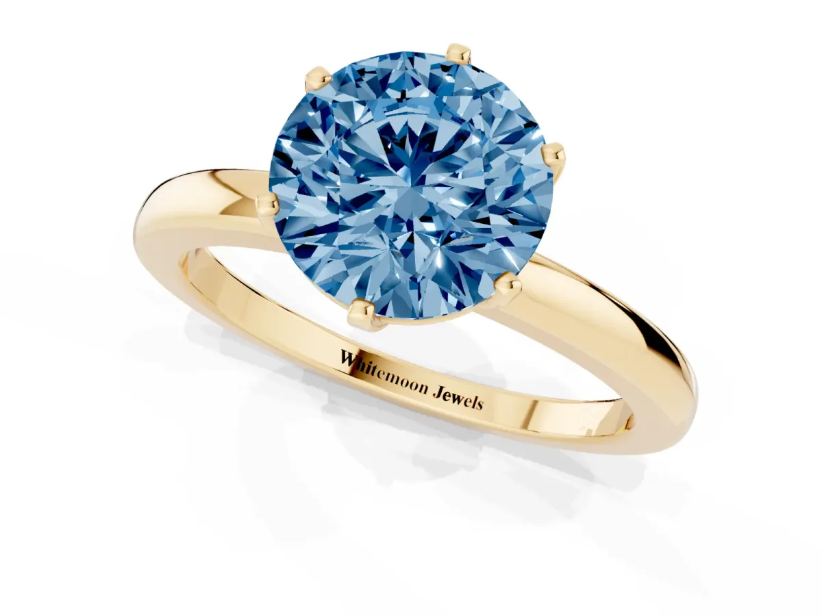 Fancy Blue Round Cut Solitaire Diamond Ring with Six-Prong Setting on a Classic Band Yellow gold