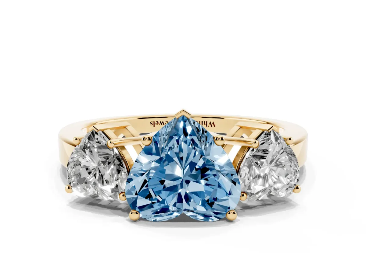 Fancy Blue Three-Stone Heart Cut Cut Diamond Engagement Ring with Flat Band and Four-Prong Setting Yellow gold