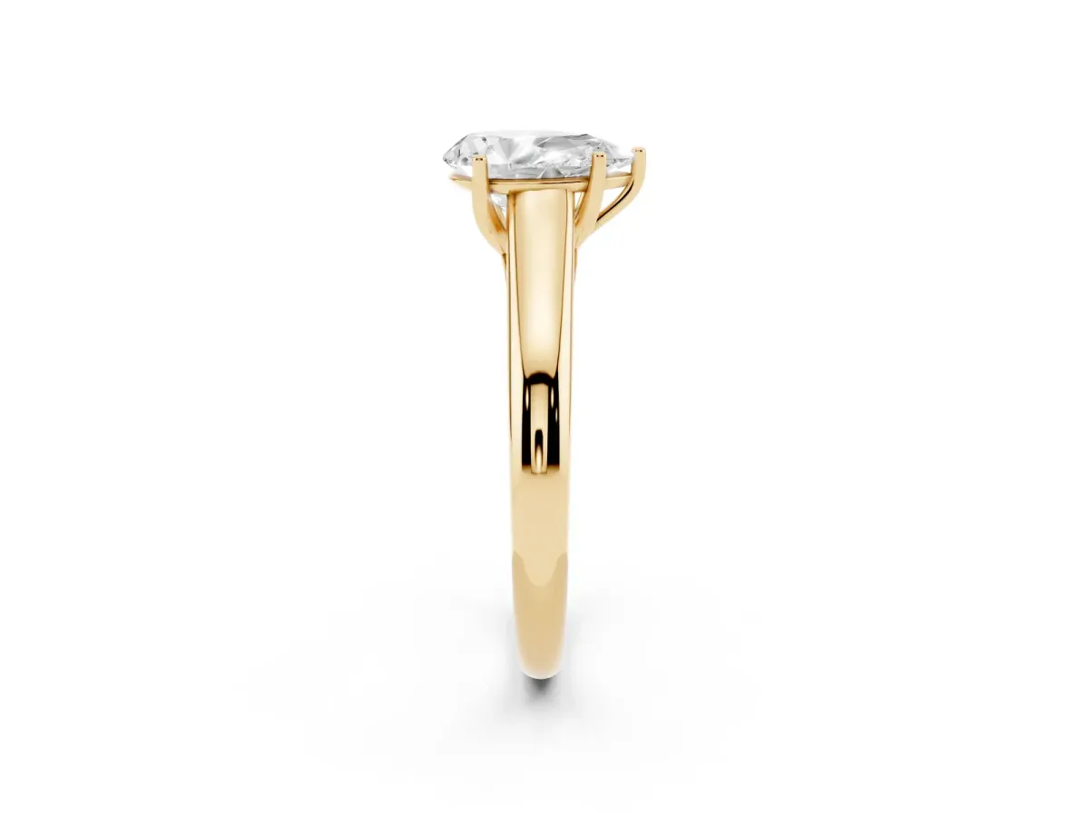 Pear Cut Solitaire Engagement Ring with Tapered Band and Four-Prong Setting Yellow gold