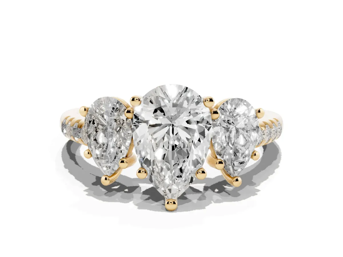 Three-Stone Pear Cut Diamond Ring with Round Pavé Band and Prong Setting Yellow gold